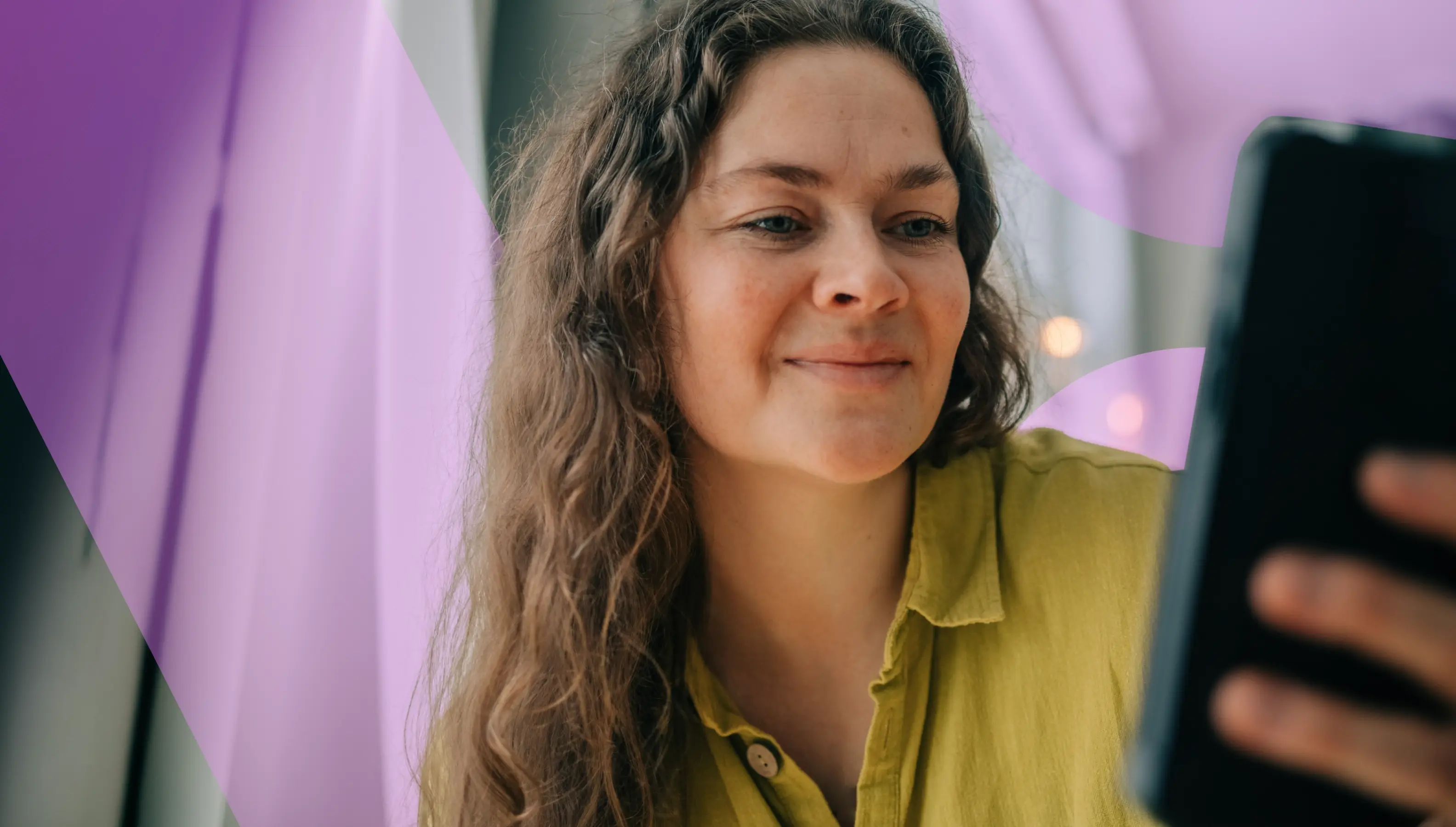 Woman smiling holding a phone with page title overlay.