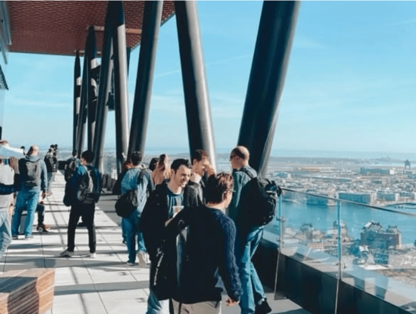 Verily employees chatting in the Boston high-rise office