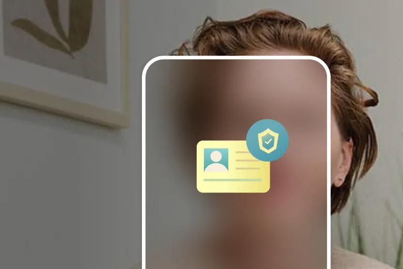 A woman looks straight ahead sitting in a waiting room. Icons representing identification and security appear inside a smartphone outline that blocks and blurs her face.