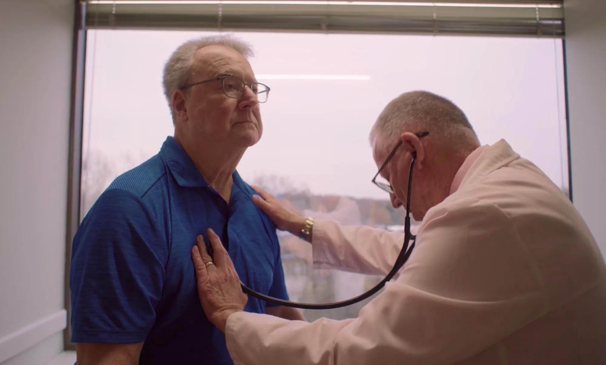 An oncologist examining a patient