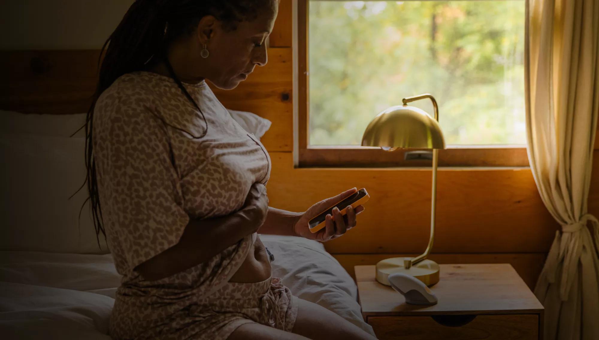 Woman reviewing health information on her smartphone