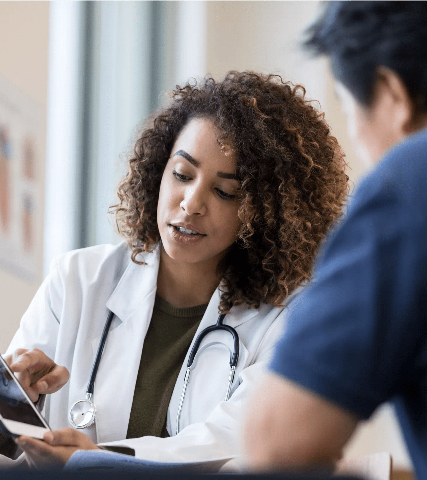 Doctor reviewing medical record with patient