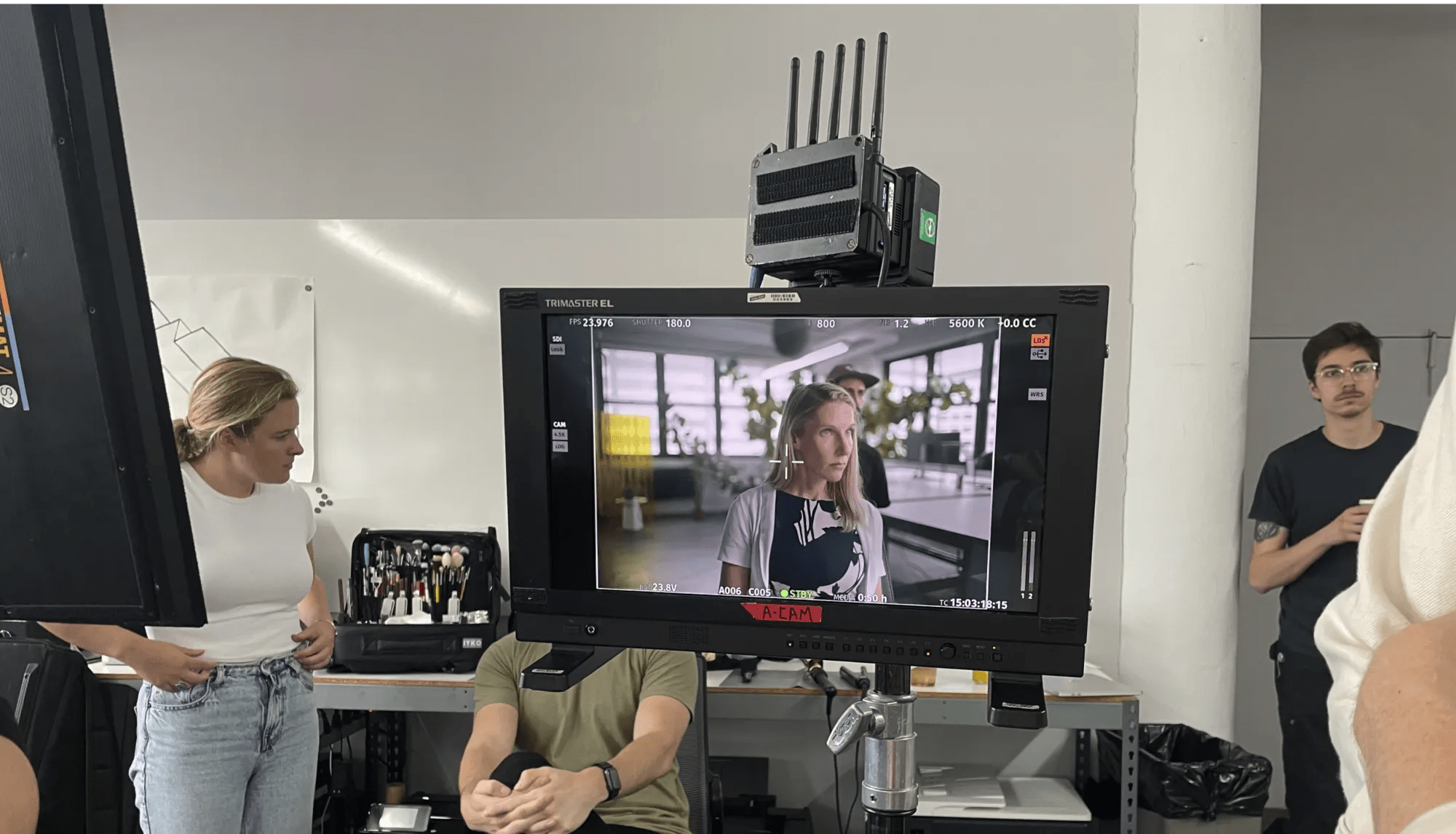 Behind-the-scenes shot of Heike Sichtig, during the filming of N of 1, featuring the camera monitor and two crew members in the background.