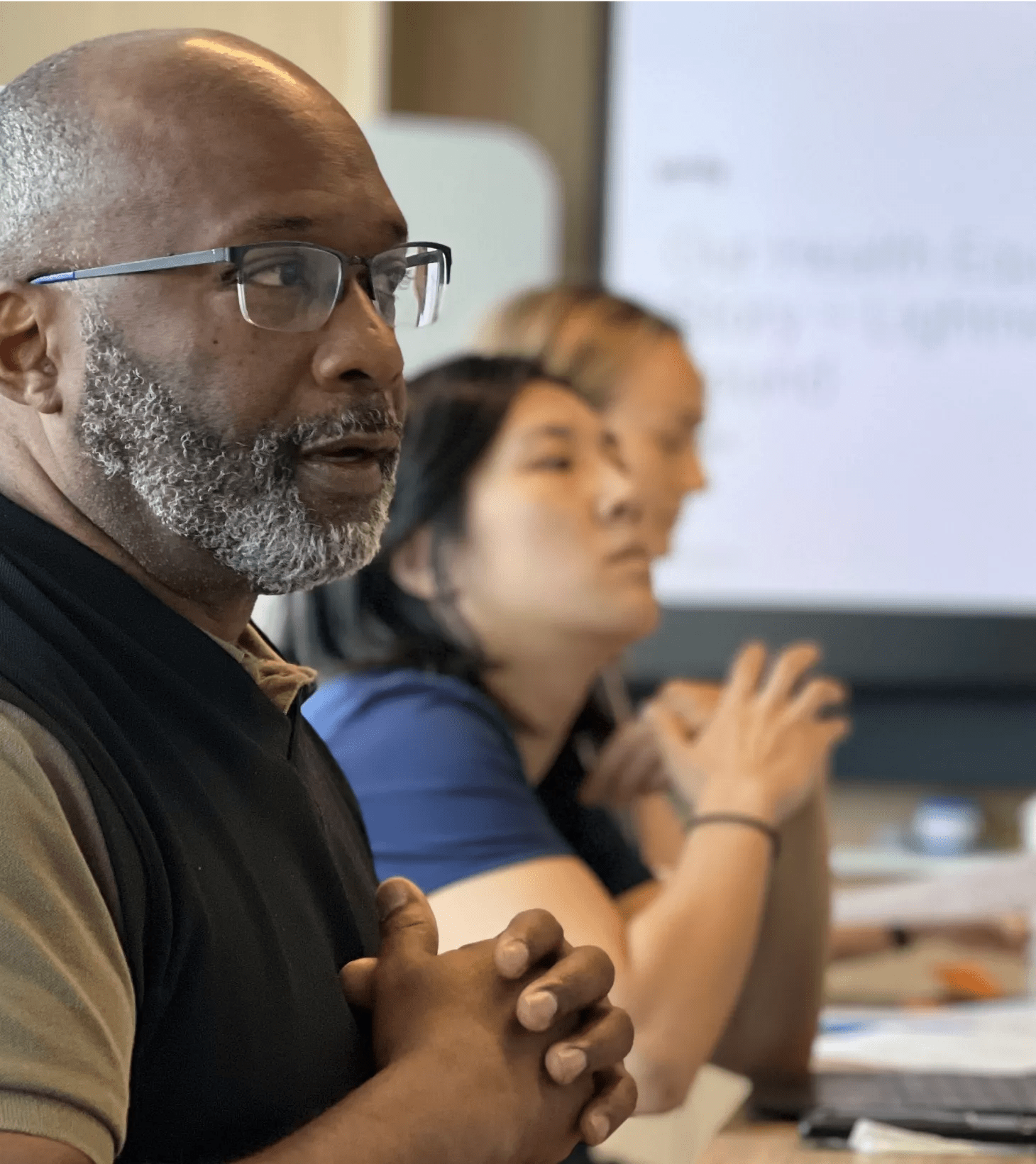 Verily employees listening to a presentation