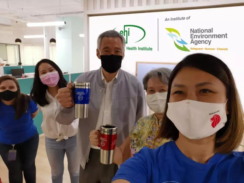 Debug team members with Prime Minister Lee Hsien Loong (center) and Mrs. Lee ( right of center)