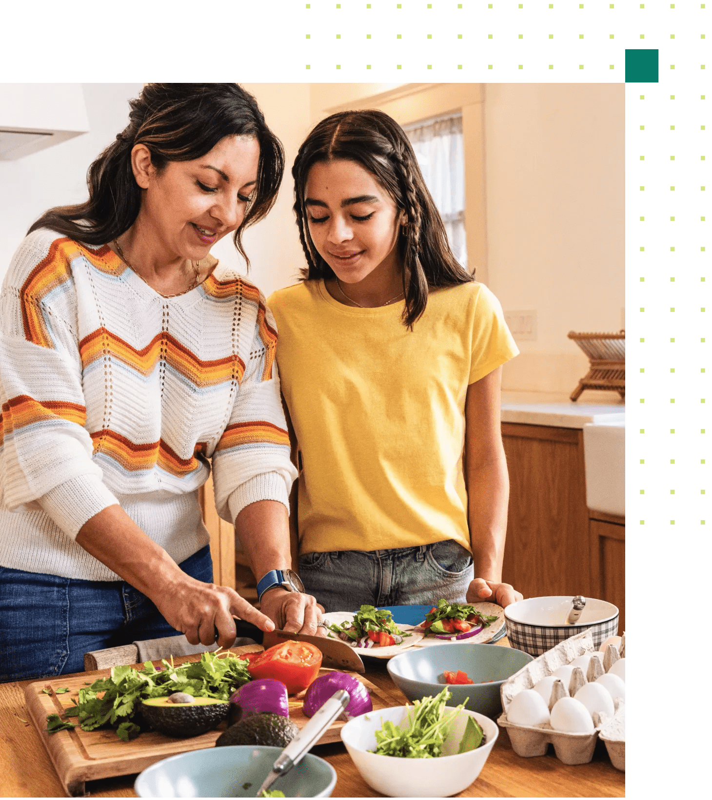 A middle-aged woman with her pre-teen daughter in their kitchen making a healthy dinner recipe.