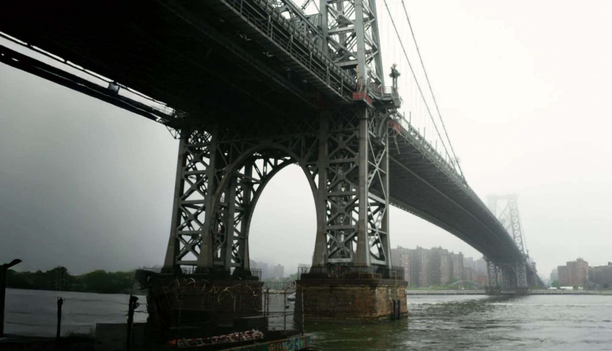Close up of Brooklyn bridge on a foggy day.