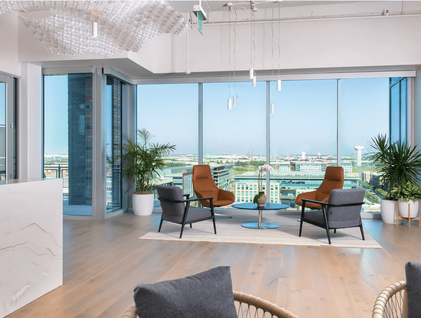 Interior of the Verily Dallas office looking out at the city skyline